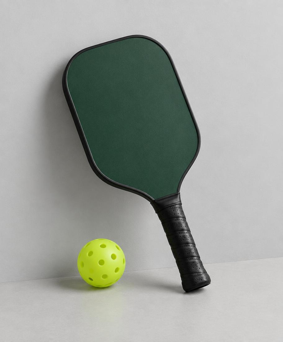 Temporary studio photograph of a deep green intermediate pickleball paddle